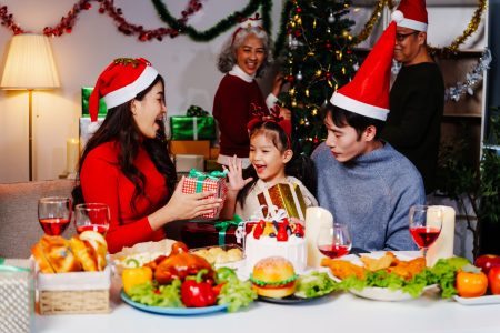 Parents, children, and grandparents gather at home for a joyful Christmas and New Year celebration